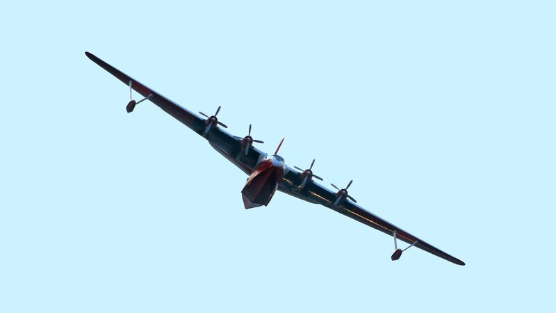 Propeller Airplane in Flight — Blue, Serene, Afternoon