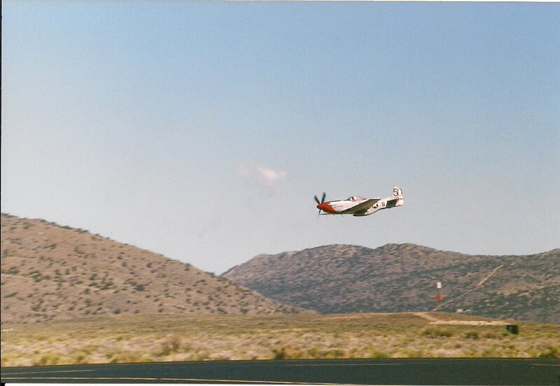 Propeller Airplane in Flight — Blue