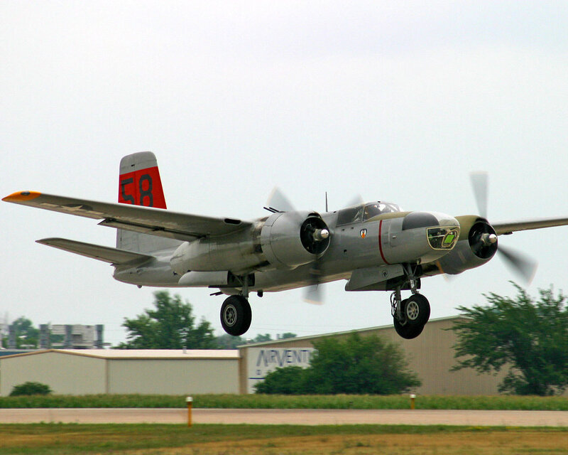 Propeller Airplane in Flight — Gray