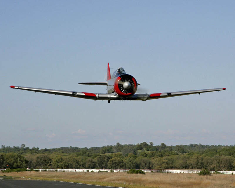 Propeller Airplane in Flight — Silver, Calm