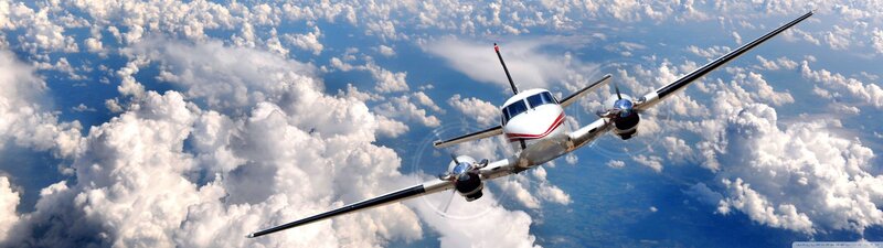 Propeller Airplane in Flight — White