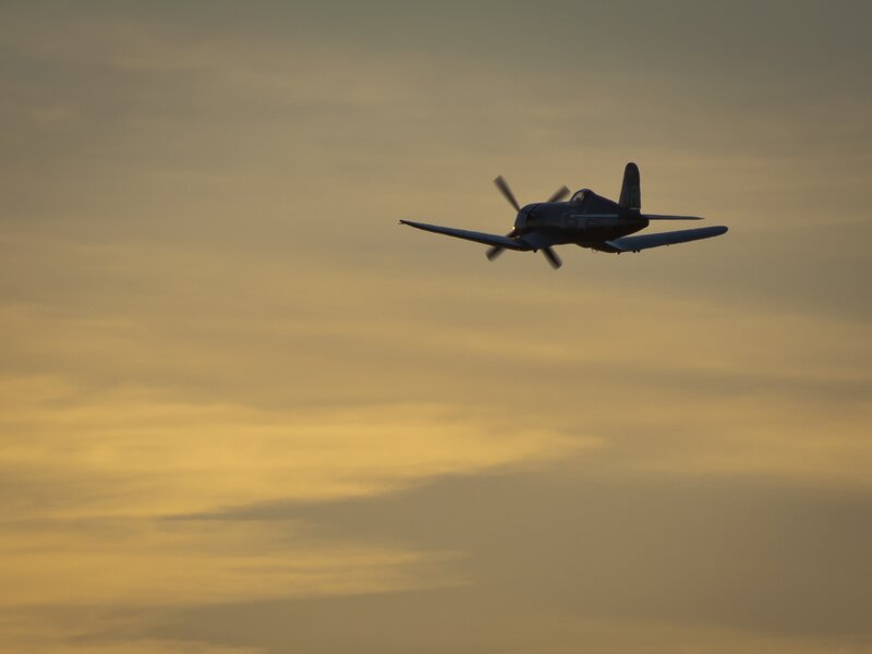 Propeller Airplane in Flight — Yellow