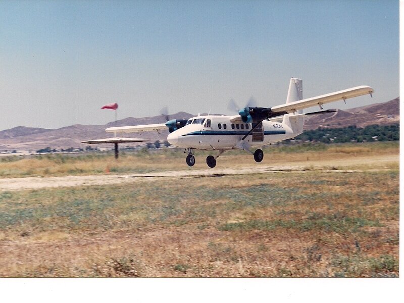 Propeller Airplane Landing — White