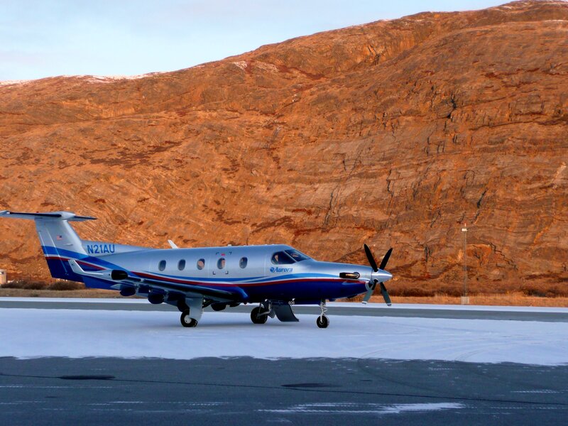 Propeller Airplane on Runway — Blue