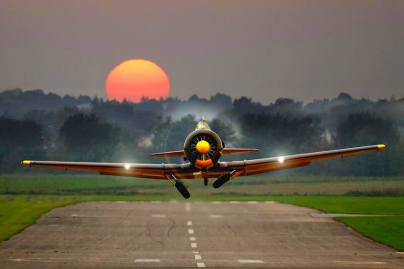 Propeller Airplane on Runway — Orange