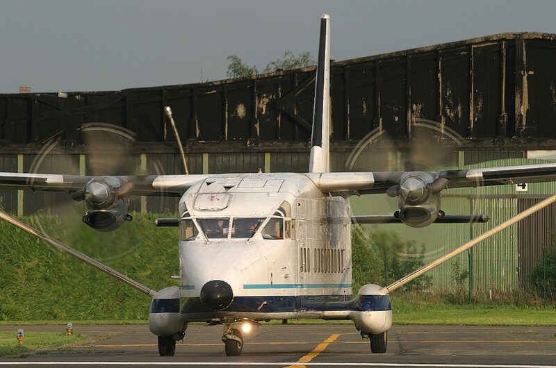 Propeller Airplane on Runway — White, Calm