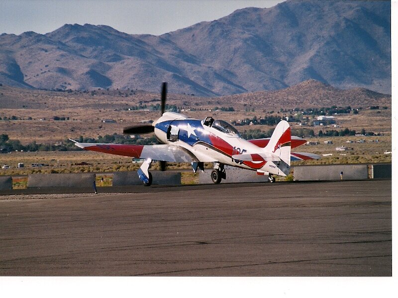 Propeller Airplane on Runway — White