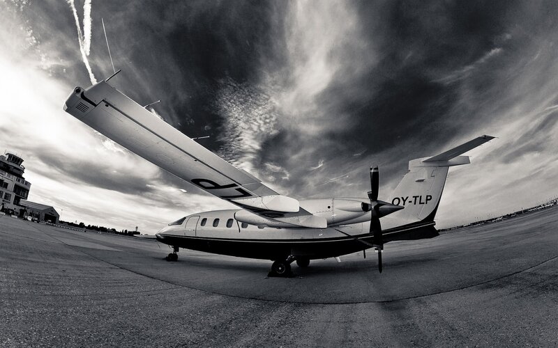 Propeller Airplane on Tarmac — Black, Dramatic