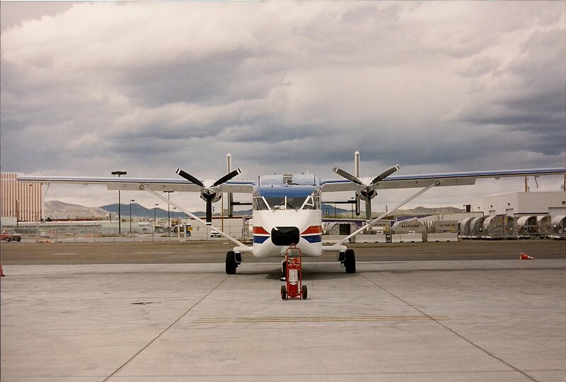 Propeller Airplane on Tarmac — White, Overcast