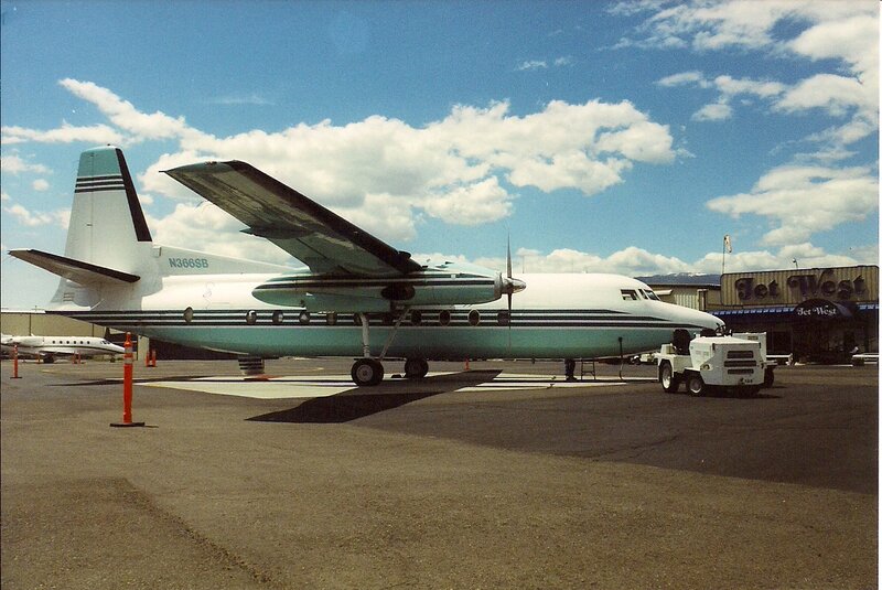 Propeller Airplane on Tarmac — White