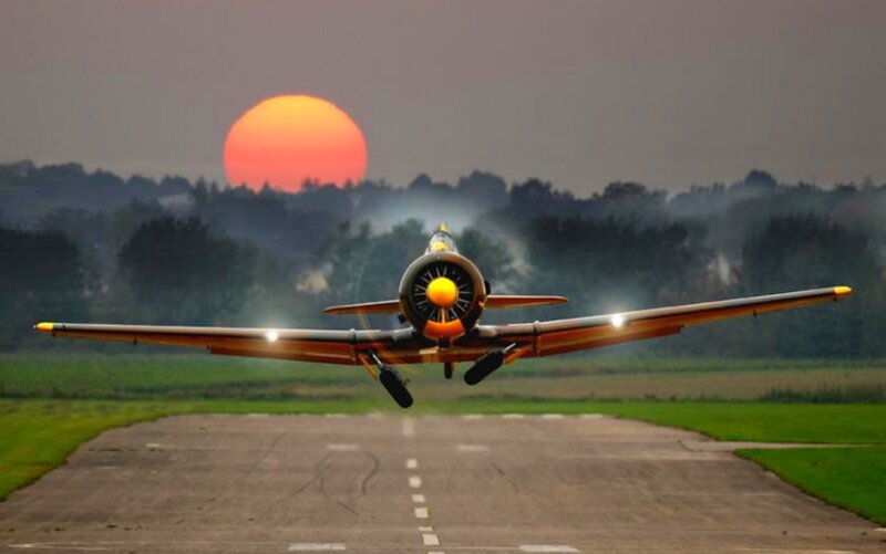 Propeller Airplane Taking Off — Orange