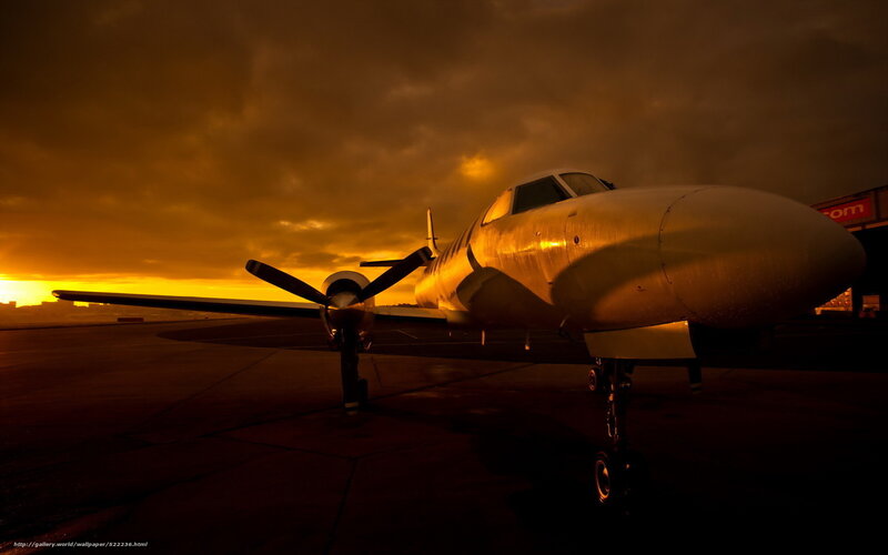 Propeller plane at sunset