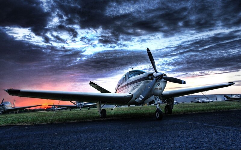 Propeller plane at sunset