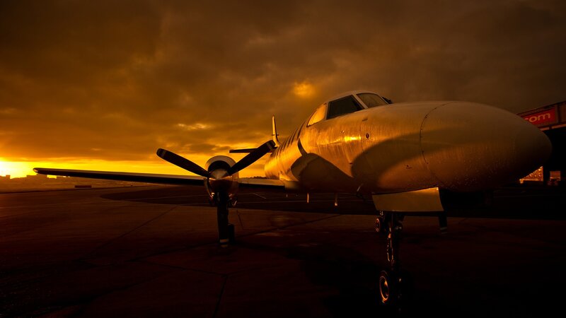Propeller plane at sunset