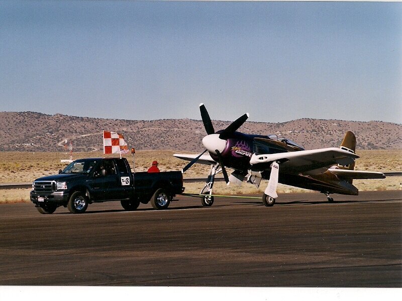 Propeller Plane on Tarmac — Brown