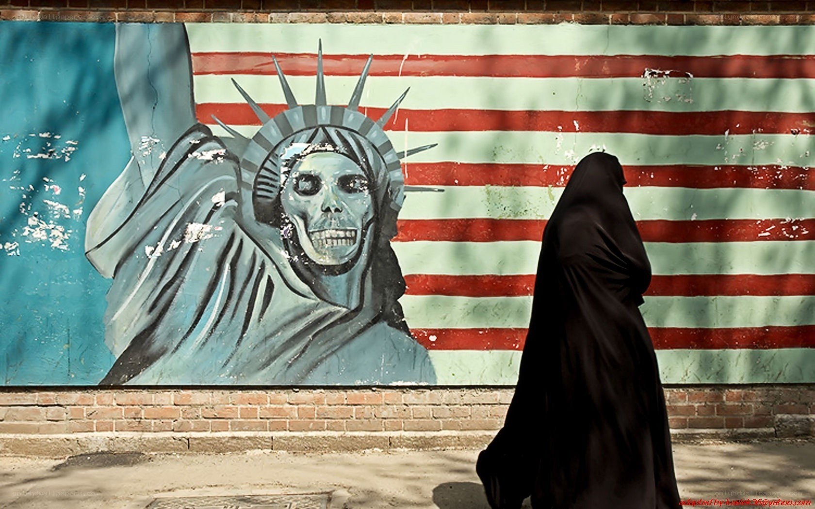 Protest mural of skeleton statue