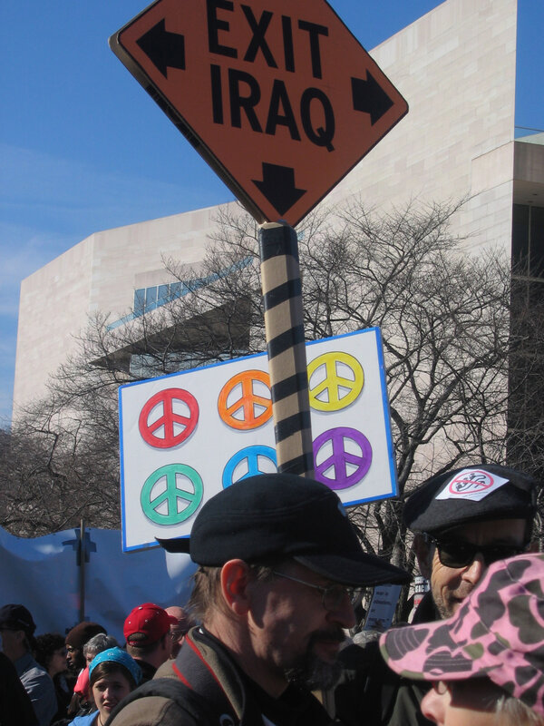 Protest sign reading EXIT IRAQ