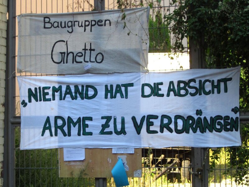Protest signs on a fence