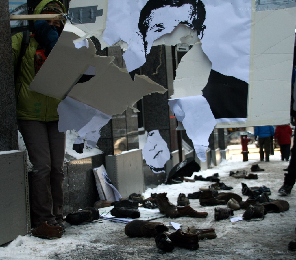 Protest with shoes and poster