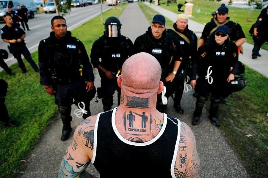 Protester facing police line