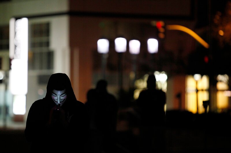 Protester in Guy Fawkes mask