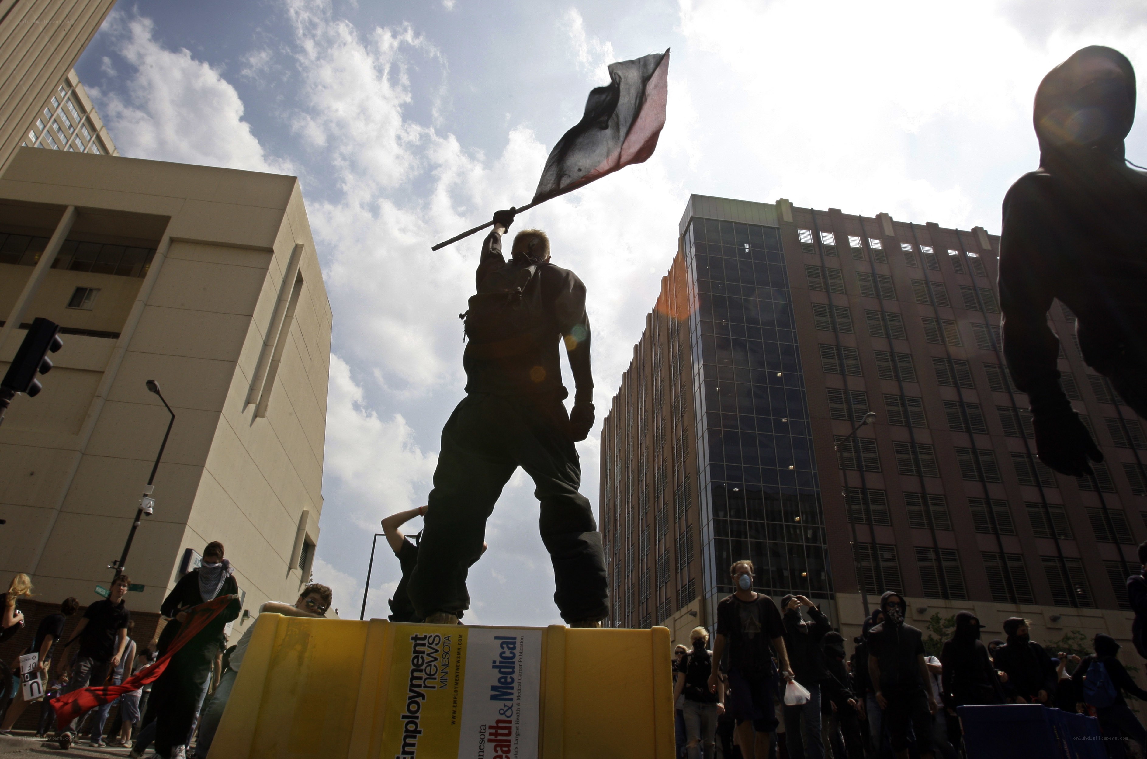Protester waving flag on barricade