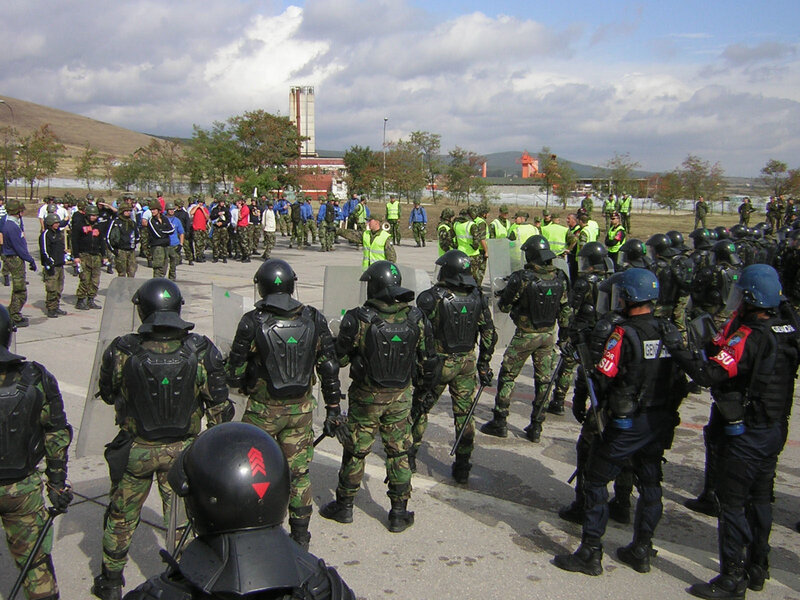 Protesters facing riot police
