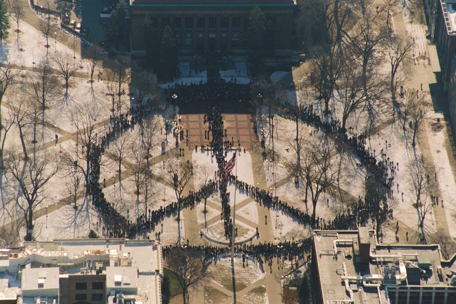 Protesters form peace symbol