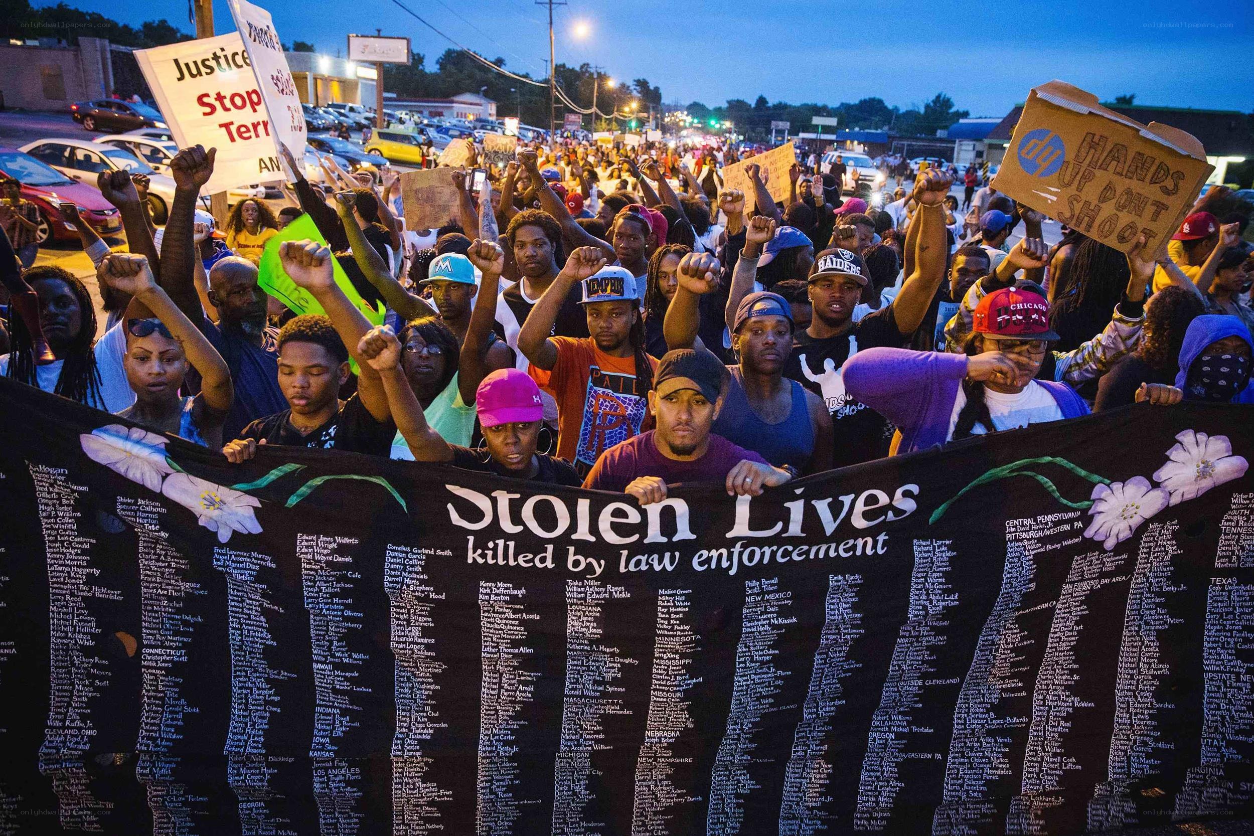 Protesters hold banner of stolen lives