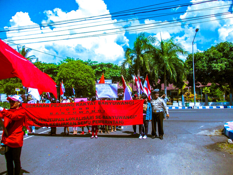 Protesters Holding Banner