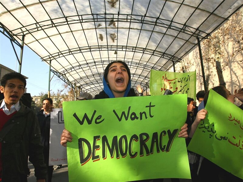 Protesters Holding Signs — Green