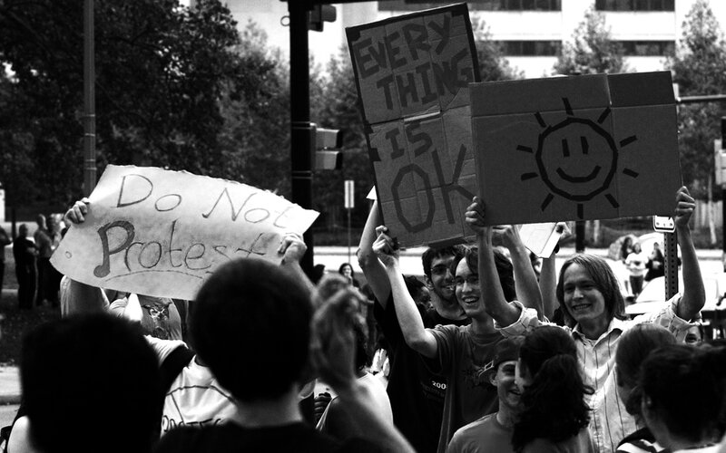 Protesters holding signs