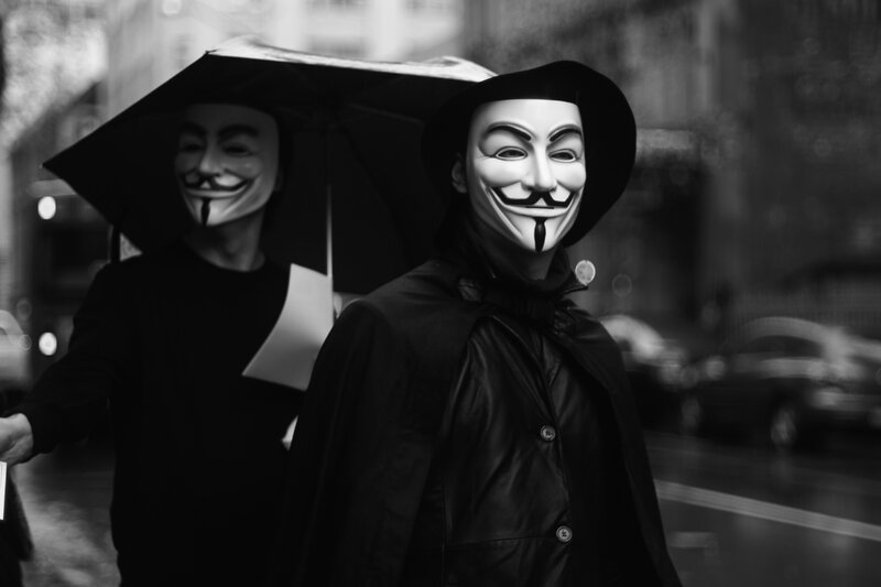 Protesters in Guy Fawkes masks