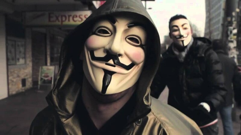 Protesters in Guy Fawkes masks