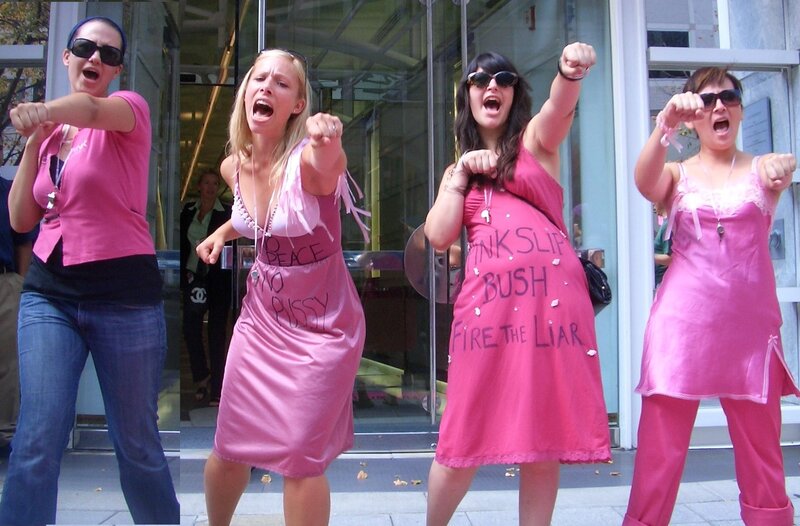Protesters in pink dresses