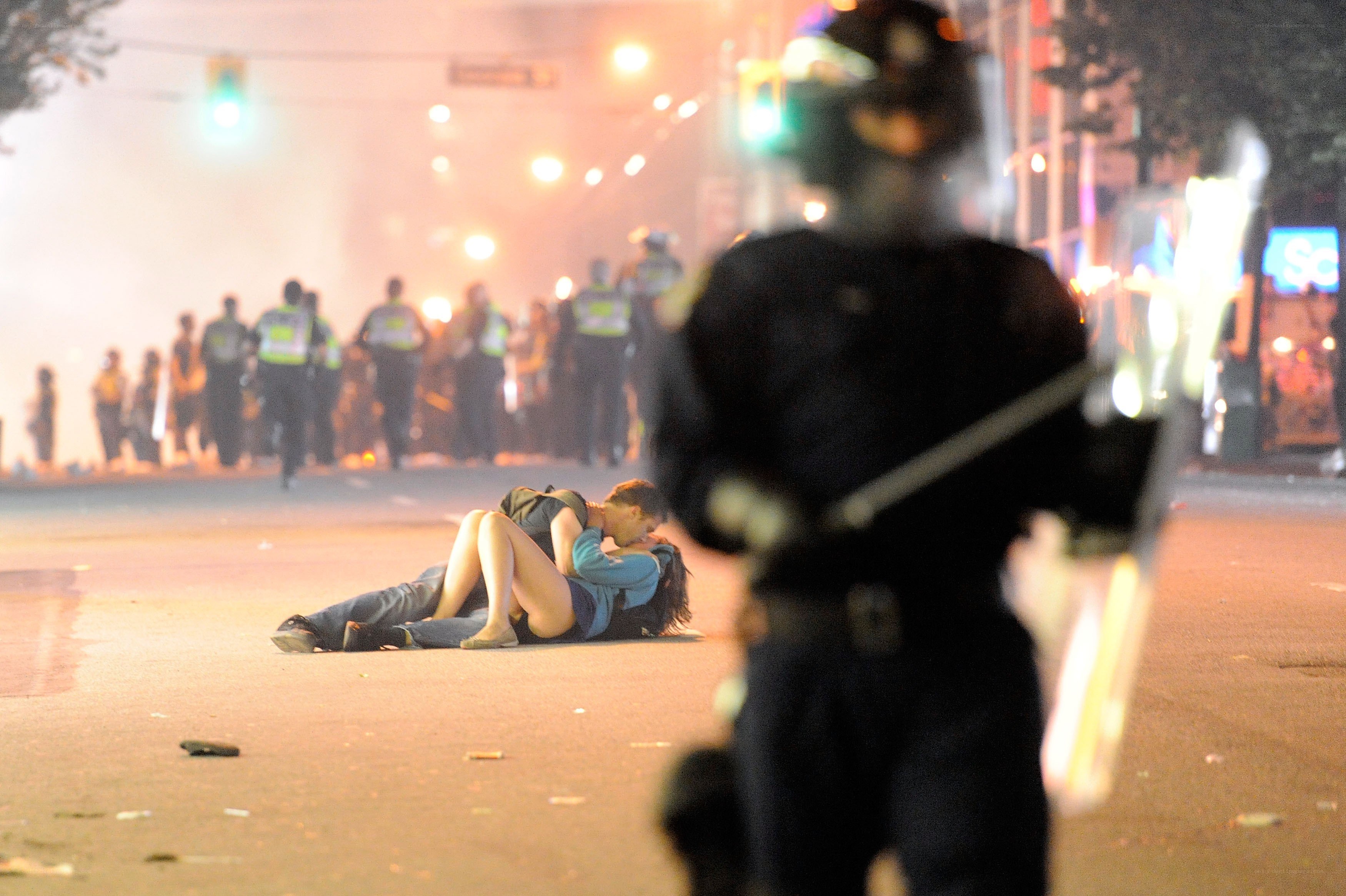 Protesters on street at night
