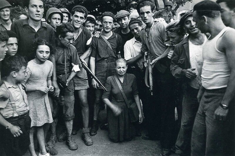 Protesters surround a woman