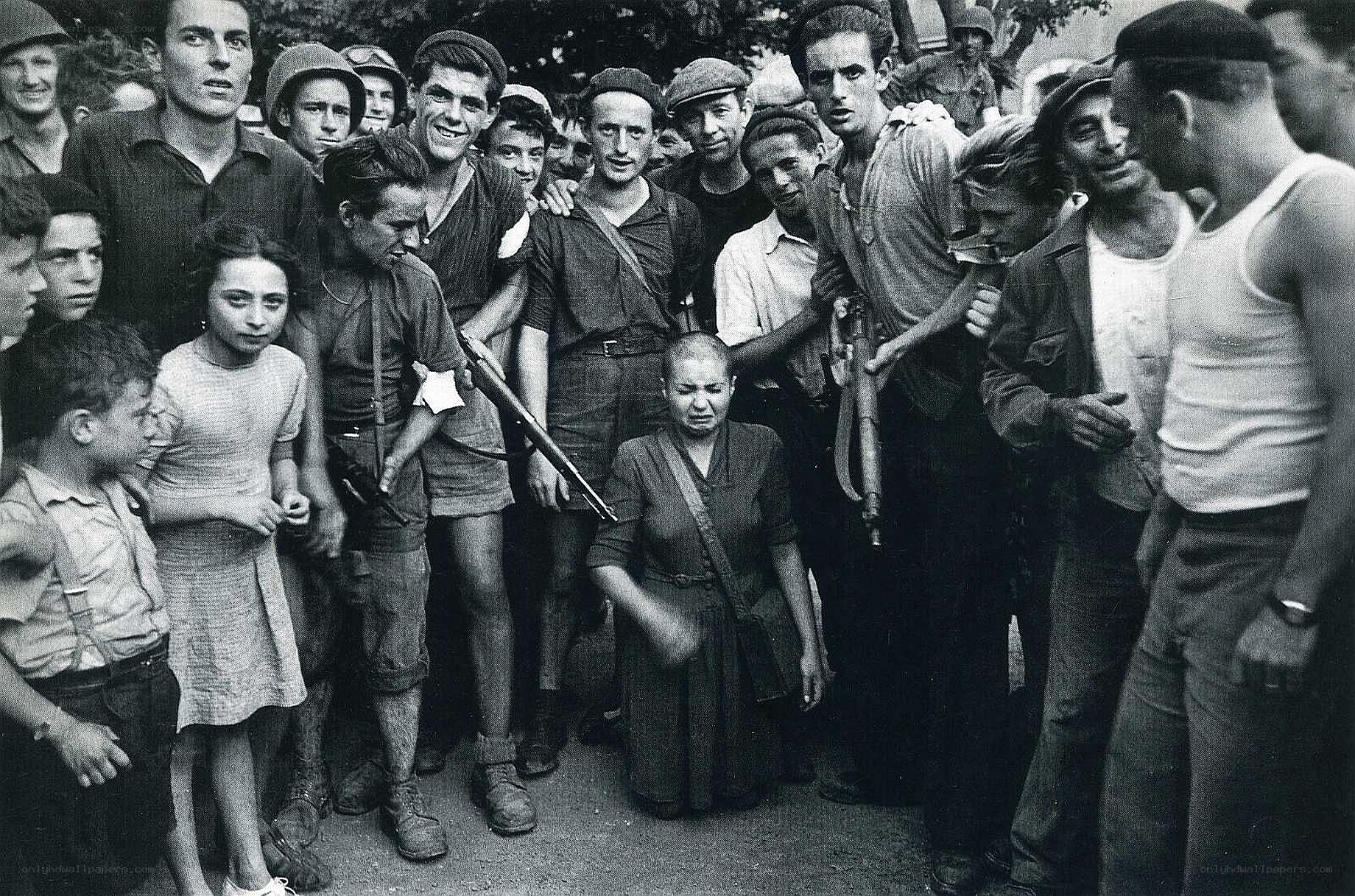 Protesters surround a woman