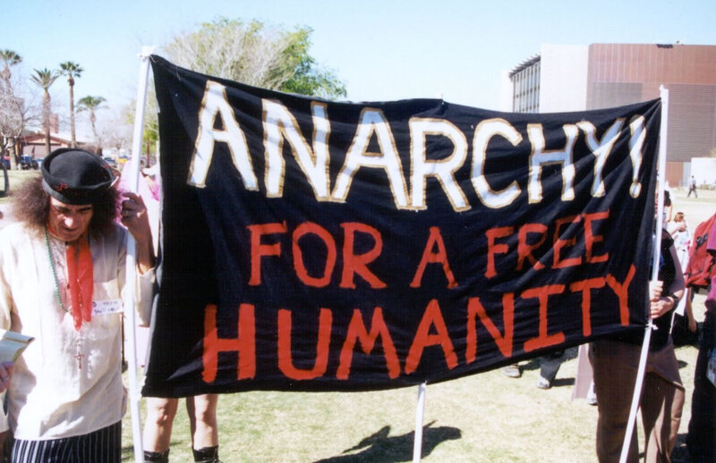Protesters with anarchy banner