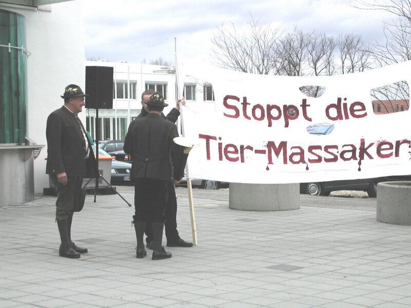 Protesters with anti-animal cruelty banner