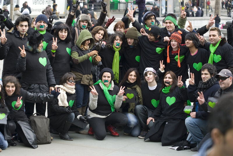 Protesters with green hearts