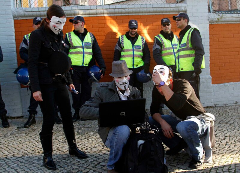 Protesters with Guy Fawkes masks