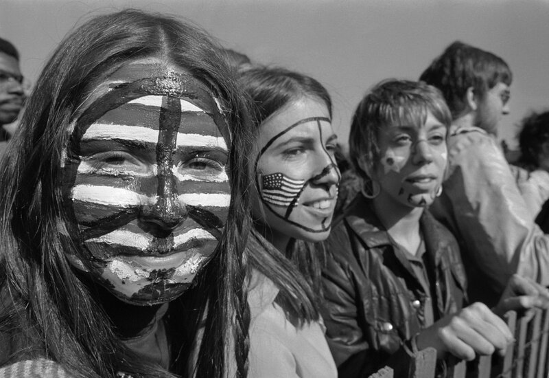 Protesters with painted faces