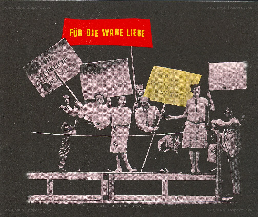 Protesters with signs on stage