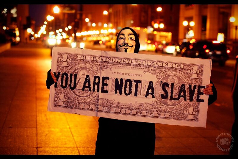 Protestor with dollar bill sign