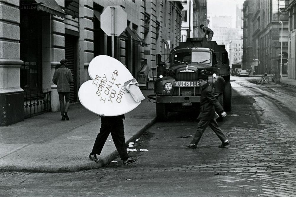 Protestor with heart sign on street