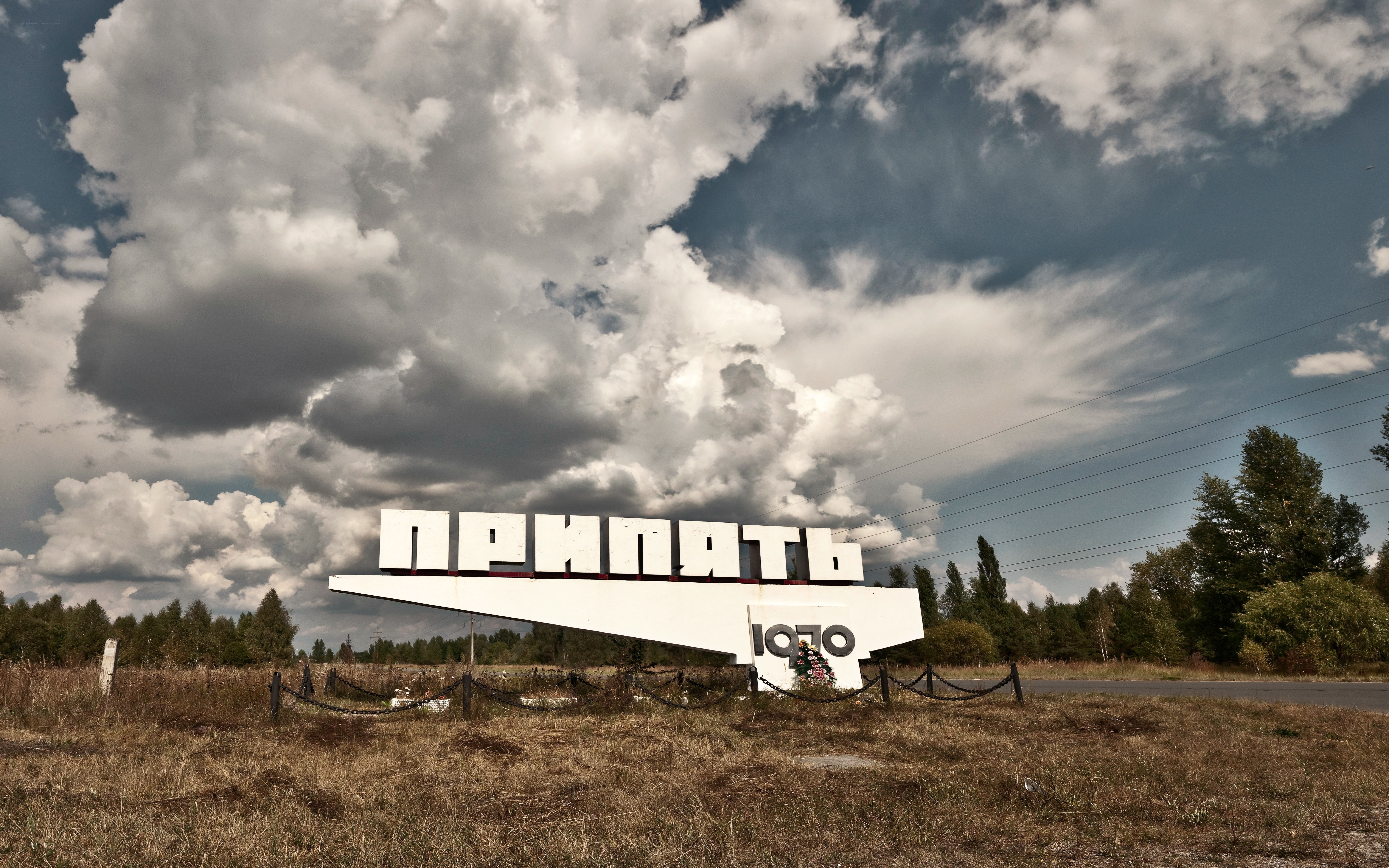 Prypeat sign under cloudy sky