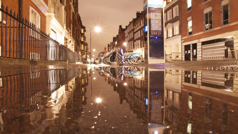 Puddle Reflecting City Street