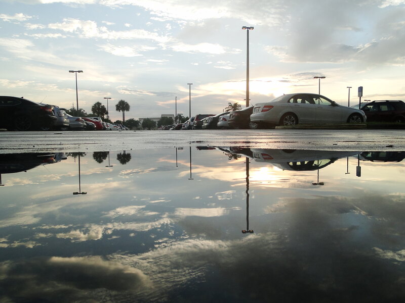 Puddle reflection in parking lot