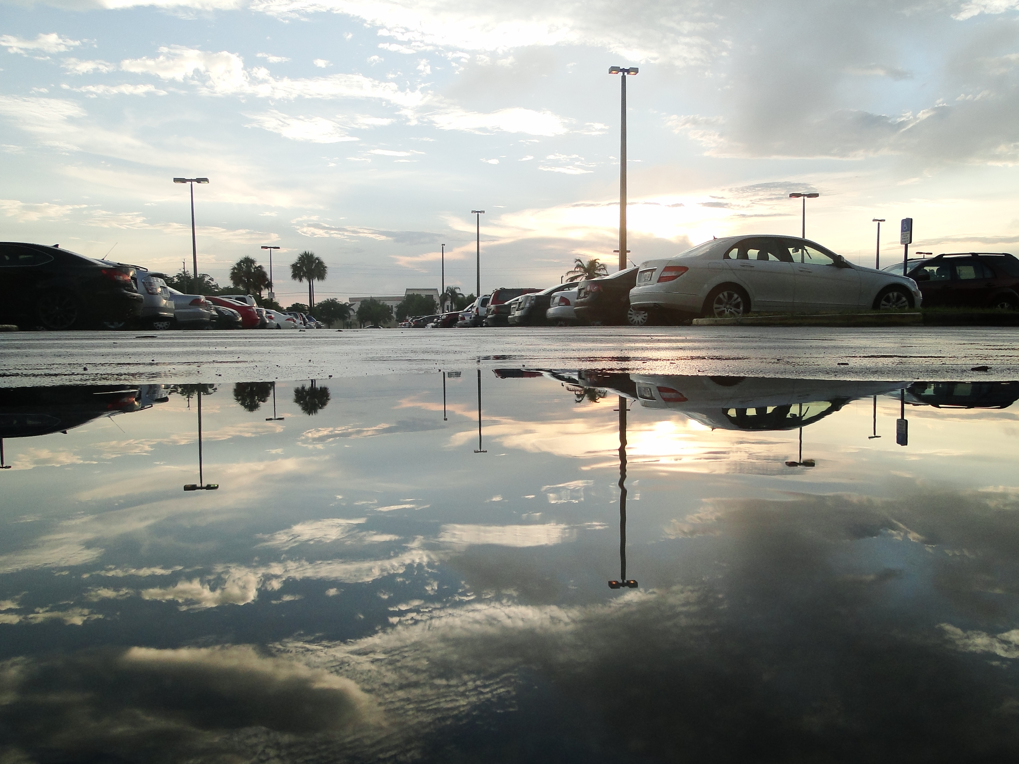Puddle reflection in parking lot